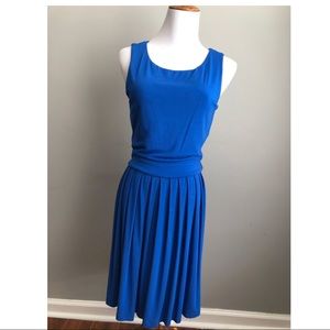 Tart pleated A-line dress with cut out back